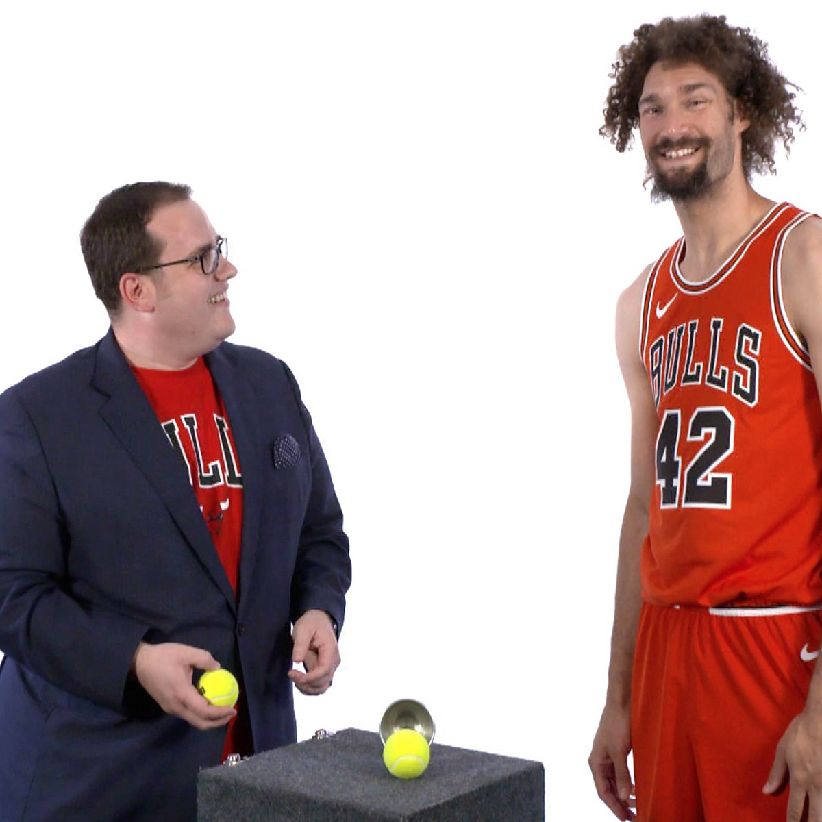 Scott Green performing close-up magic for Chicago Bulls center Robin Lopez at media day